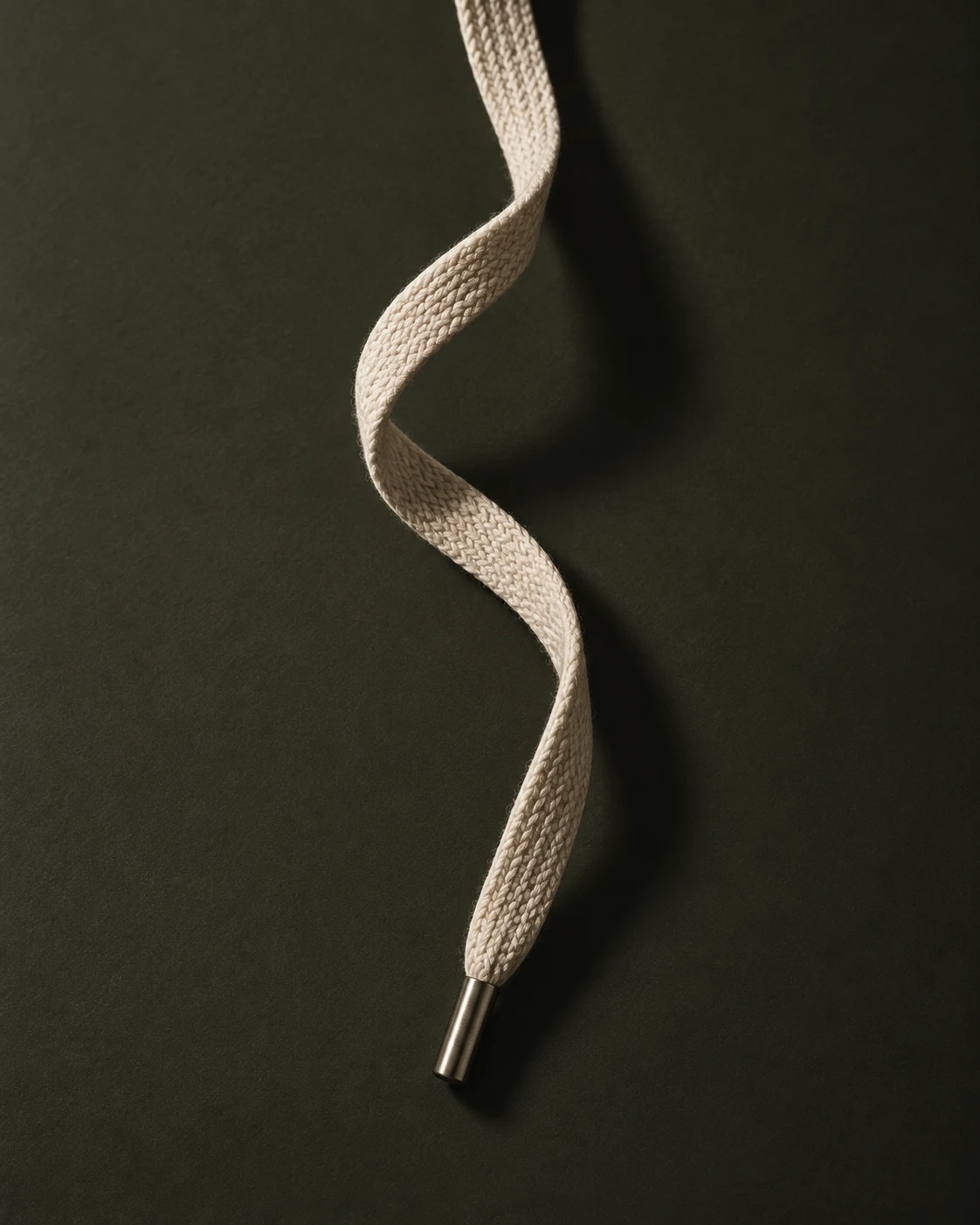 A woven bone-coloured lace on olive graphite